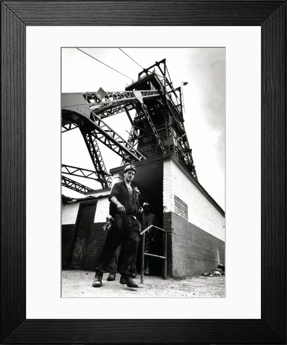 Framed Print : Coal - Miners - General mining shot showing a miner with the winding gear in Framed Print : Coal - Miners - General mining shot showing a miner with the winding gear in