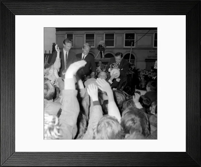 Framed Print : Jack and Bobby Charlton look over-awed as youngsters crowd around the car taking them to Framed Print : Jack and Bobby Charlton look over-awed as youngsters crowd around the car taking them to