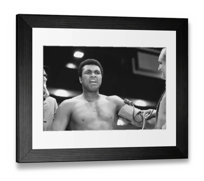 Framed Print : Muhammad Ali seen here having his blood pressure taken during thge pre fight medical