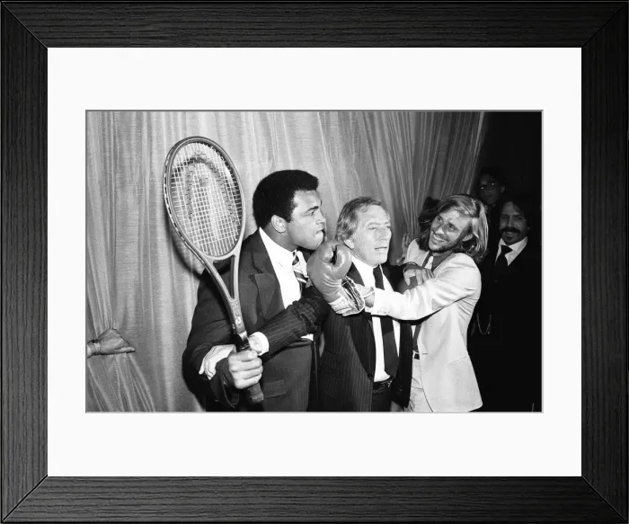 Framed Print : Singer Andy Williams breaks steps inbetween Heavyweight Boxing champion who is holding a Framed Print : Singer Andy Williams breaks steps inbetween Heavyweight Boxing champion who is holding a