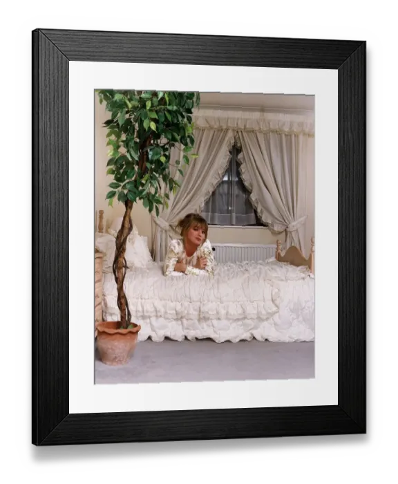 Framed Print : Suzanne Mizzi Model laying on bed A©Mirrorpix Framed Print : Suzanne Mizzi Model laying on bed A©Mirrorpix