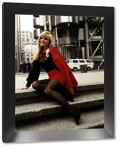 Suzanne Mizzi Model sitting on steps outside the Lloyds building