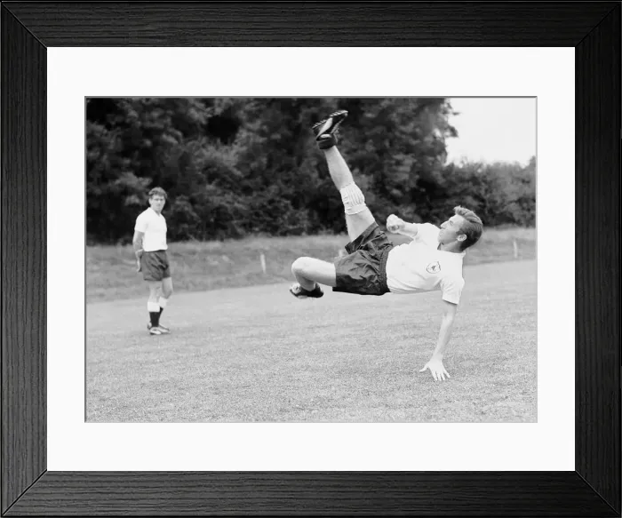 Framed Print : Tottenham Hotspur footabller Cliff Jones tries a spectacular overhead kick during a