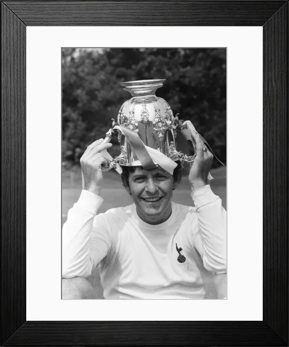Framed Print : Tottenham Hotspur footballer Alan Mullery poses with the League Cup trophy upside down Framed Print : Tottenham Hotspur footballer Alan Mullery poses with the League Cup trophy upside down