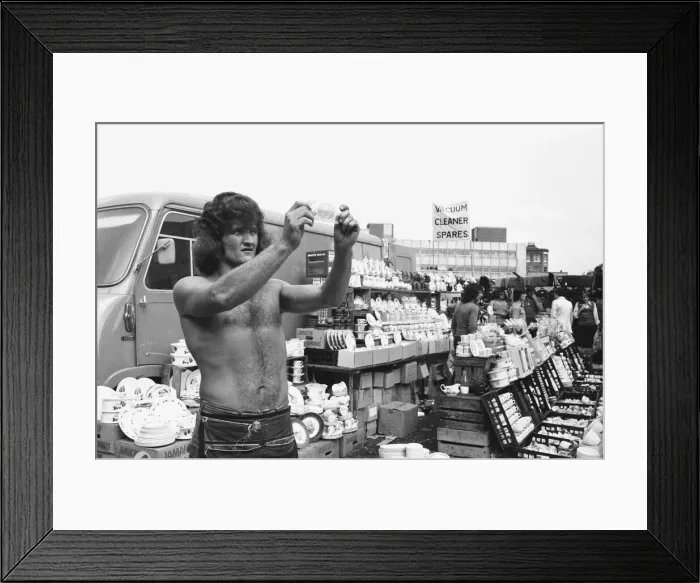 Framed Print : Bare chested Alan Dobbs who runs a pottery stall in London Framed Print : Bare chested Alan Dobbs who runs a pottery stall in London