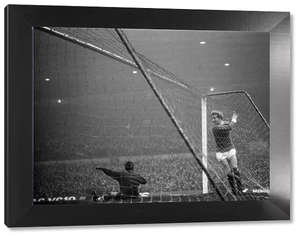 Manchester United forward Denis Law in the back of the Liverpool goal after scoring