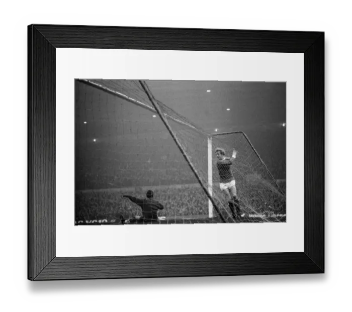 Framed Print : Manchester United forward Denis Law in the back of the Liverpool goal after scoring Framed Print : Manchester United forward Denis Law in the back of the Liverpool goal after scoring