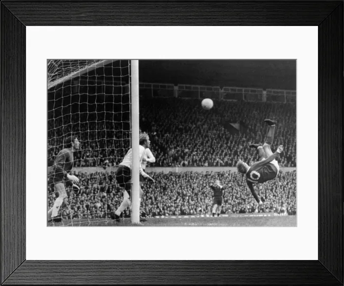 Framed Print : Manchester United v Tottenham Hotspur Denis Law sends in an overhead shot Framed Print : Manchester United v Tottenham Hotspur Denis Law sends in an overhead shot