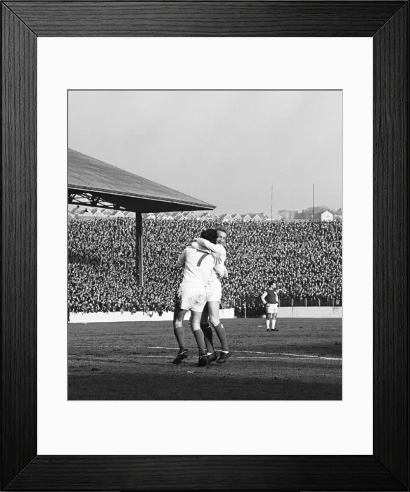 Framed Print : Manchester United star George Best is celebrates with team mate Denis Law after scoring Framed Print : Manchester United star George Best is celebrates with team mate Denis Law after scoring