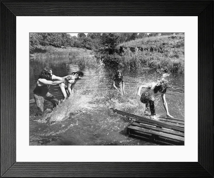 Framed Print : Members of Heavy Metal group Black Sabbath messing about on the river in the scenic Wye