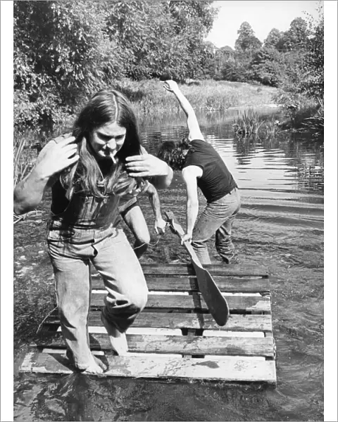 Members of Heavy Metal group Black Sabbath messing about on the river in the scenic Wye