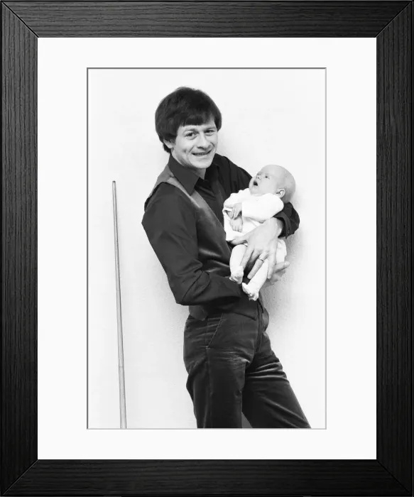 Framed Print : Snooker player Alex Hurricane Higgins with his baby daughter Lauren Framed Print : Snooker player Alex Hurricane Higgins with his baby daughter Lauren