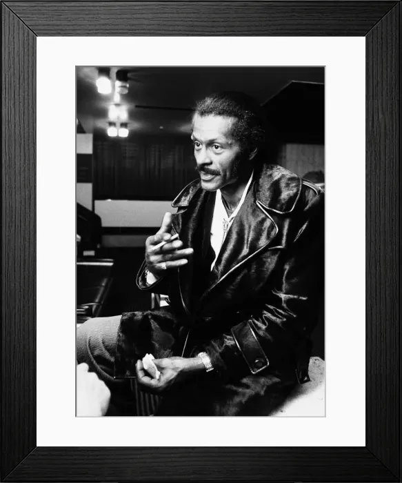 Framed Print : American rock n roll singer Chuck Berry smoking a cigarette after a concert