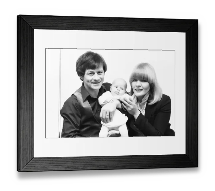 Framed Print : Snooker player Alex Hurricane Higgins with his baby daughter Lauren