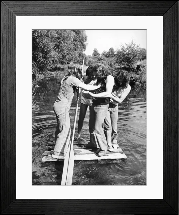 Framed Print : Members of Heavy Metal group Black Sabbath messing about on the river in the scenic Wye