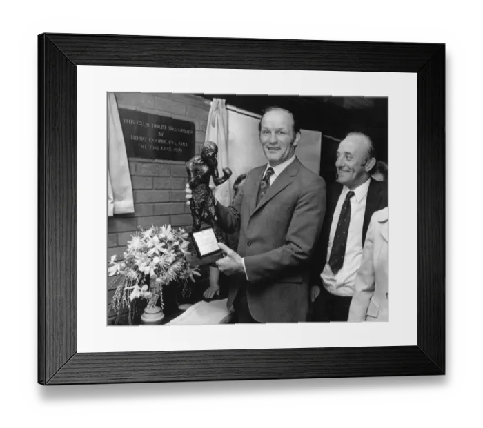 Framed Print : Former British Heavyweight champion boxer Henry Cooper holds a bronze statue of himself Framed Print : Former British Heavyweight champion boxer Henry Cooper holds a bronze statue of himself
