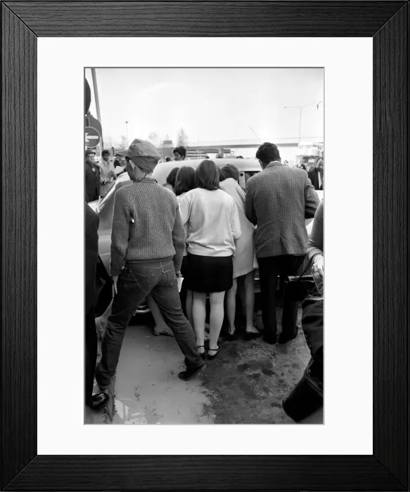 Framed Print : Fans watching the Rolling Stones leaving London Heathrow after arriving from Athens Framed Print : Fans watching the Rolling Stones leaving London Heathrow after arriving from Athens