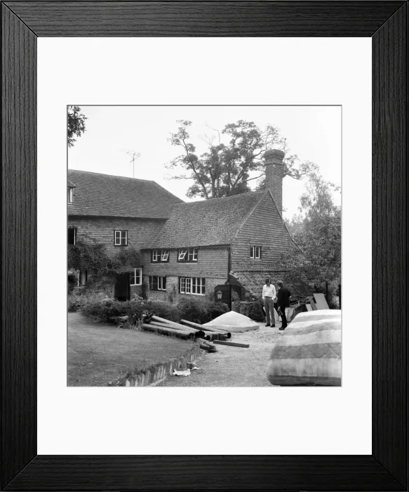 Framed Print : Rolling Stones: Brian Jones death. Tom Keylock, Stones gofer, outside Cotchford Farm