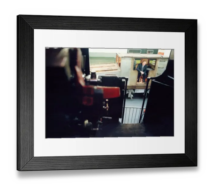 Framed Print : Lou Avis of Siemens Electronics takes a look at the 1909 Siemens engine being restored