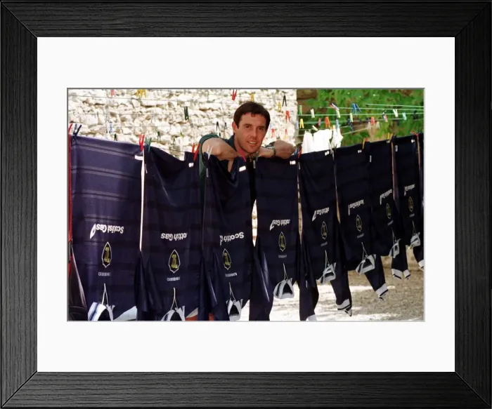 Framed Print : David Weir posing beside a washing line holding Scotland tops during the World Cup