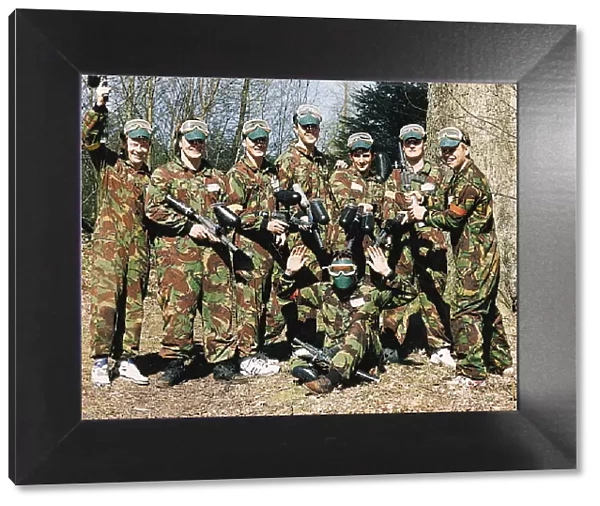 Falkirk FC players wearing camouflage jackets during a team bonding paintball session