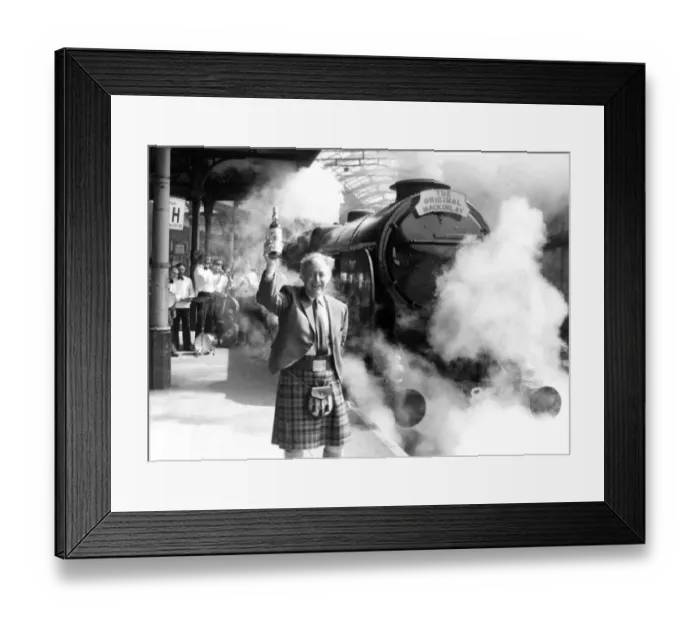 Framed Print : Donald Mackinlay of distillers Charles Mackinlay toasts the departure of the 1926 Lord