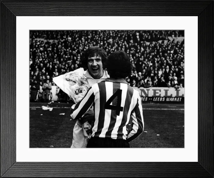 Framed Print : Leeds v. Southampton. Leeds United player Norman Hunter receives a bunch of flowers Framed Print : Leeds v. Southampton. Leeds United player Norman Hunter receives a bunch of flowers
