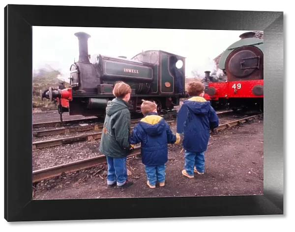 Thee little ones study steam locomotives at the Tanfield Railway engine sheds which were
