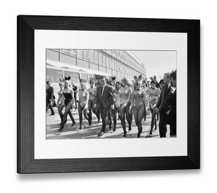 Framed Print : Hugh Hefner Boss of the Playboy Empire arrives with an entourage of Bunny Girls at London Framed Print : Hugh Hefner Boss of the Playboy Empire arrives with an entourage of Bunny Girls at London
