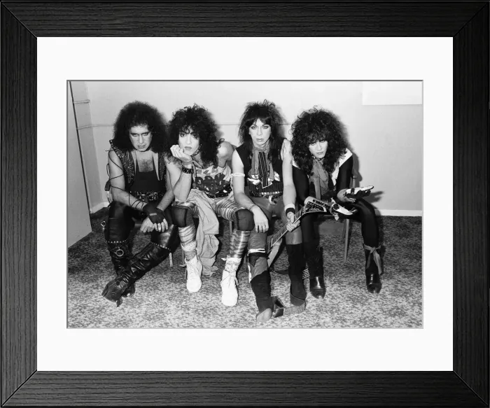 Framed Print : American rock group Kiss seen here in a very quick break between numbers at their concert