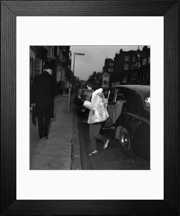 Framed Print : Brian Jones girlfriend accompanying him entering The Harley Street Nursing Home for Framed Print : Brian Jones girlfriend accompanying him entering The Harley Street Nursing Home for