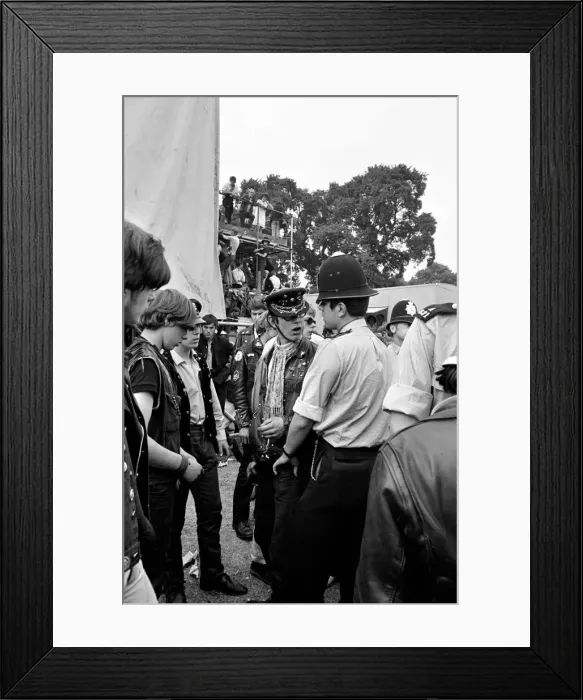 Framed Print : Police talk with Hells Angels at The Rolling Stones on stage at their free concert in Framed Print : Police talk with Hells Angels at The Rolling Stones on stage at their free concert in