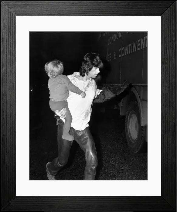Framed Print : Rolling Stones: Keith Richard backstage with his son Marlon March 1971