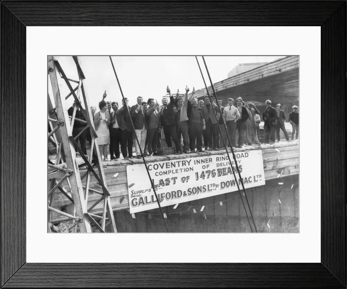 Framed Print : Fifty men with a bottle of beer each to celebrate the lowering into position of the last Framed Print : Fifty men with a bottle of beer each to celebrate the lowering into position of the last
