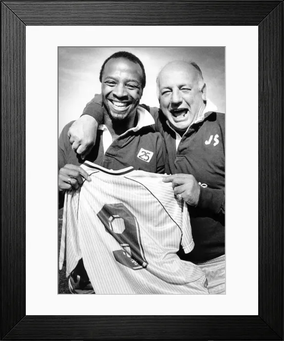 Framed Print : Sky Blues manager John Sillett hands the number 9 shirt to Cyrille Regis for tomorrow Framed Print : Sky Blues manager John Sillett hands the number 9 shirt to Cyrille Regis for tomorrow