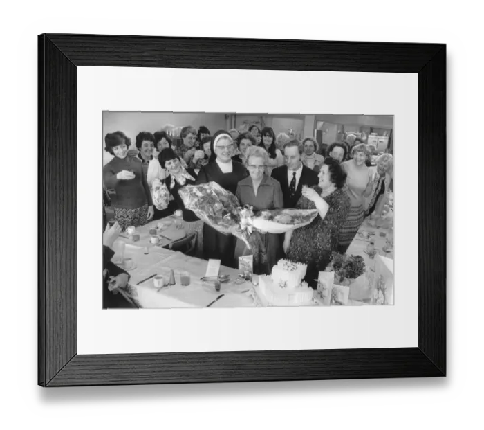 Framed Print : Staff at Cardinal Wiseman School, Coventry, raise their glasses to the kitchen supervisor