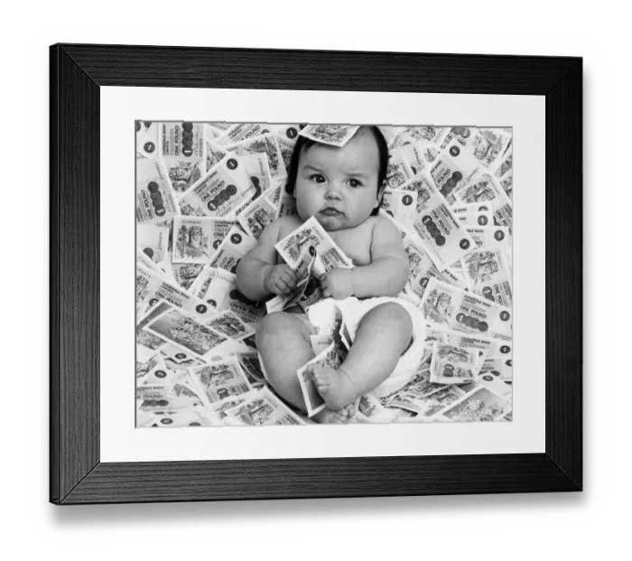 Framed Print : Baby Diane from Glasgow, Scotland, surrounded by bank notes from Clydesdale Bank Limited