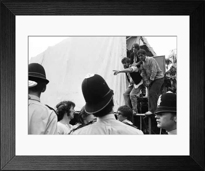 Framed Print : Rolling Stones Concert in Hyde Park. An injured fan points out a member of The Hell Framed Print : Rolling Stones Concert in Hyde Park. An injured fan points out a member of The Hell