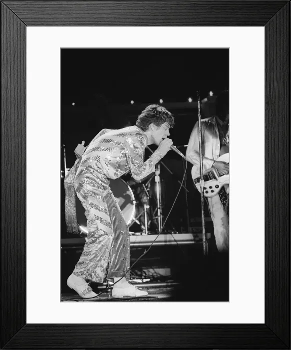 Framed Print : The Rolling Stones. Mick Jagger sings on stage with the Stones during a concert Framed Print : The Rolling Stones. Mick Jagger sings on stage with the Stones during a concert