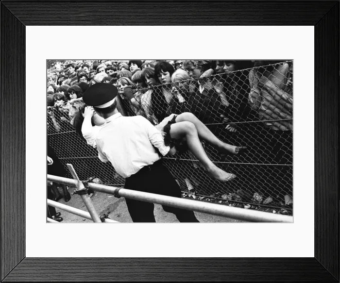 Framed Print : The Rolling Stones at Longleat, home of Lord Bath. Fainting girl fans are carried Framed Print : The Rolling Stones at Longleat, home of Lord Bath. Fainting girl fans are carried