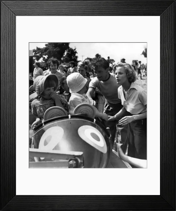 Framed Print : Honor Blackman and Richard Burton in a fairground Framed Print : Honor Blackman and Richard Burton in a fairground