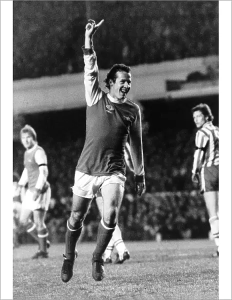 Liam Brady Arsenal Football Player celebrates after scoring goal. March 1980