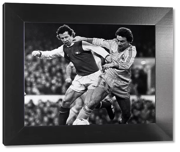 Martin O Neill of Nottingham Forest & Liam Brady of Arsenal challenge for ball