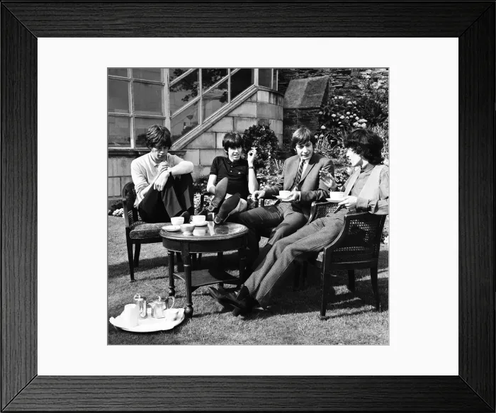 Framed Print : The Rolling Stones having a cup of tea in their hotel garden at Douglas