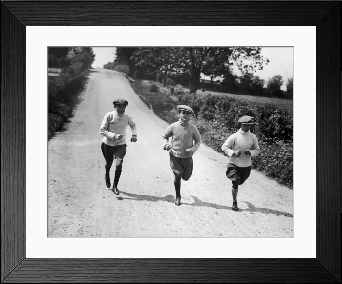 Framed Print : Apprentice jockeys jogging down a country lane during training to reduce their weight for Framed Print : Apprentice jockeys jogging down a country lane during training to reduce their weight for