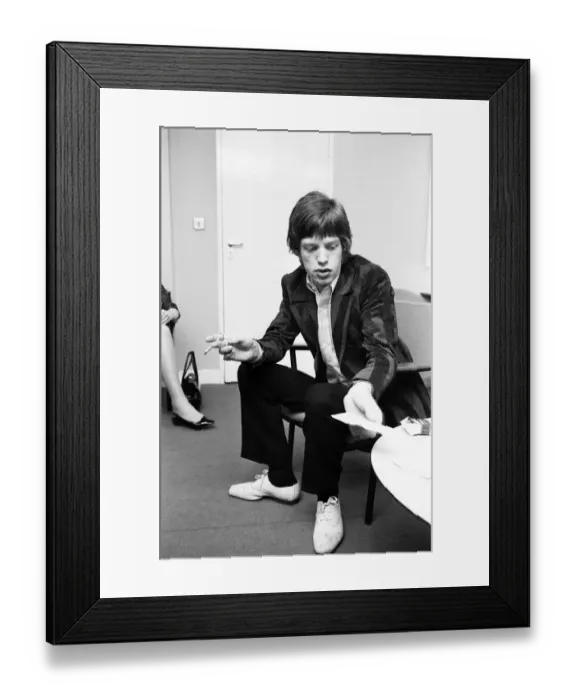 Framed Print : The Rolling Stones. Mick Jagger talks with the Press during a break in rehearsals