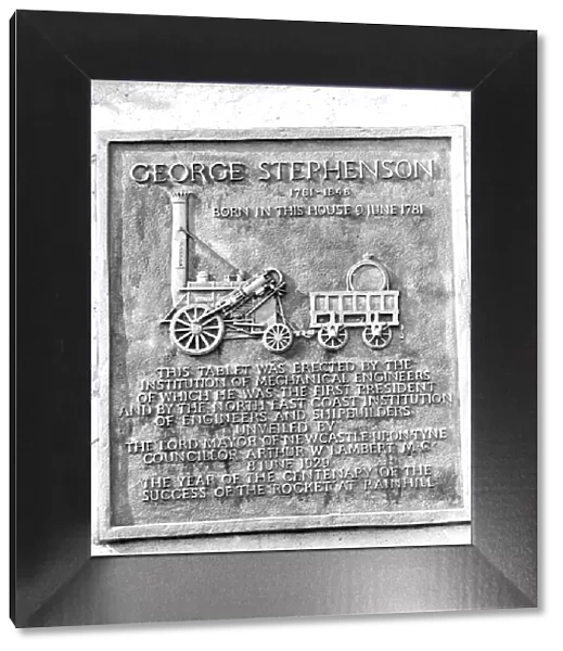 A plaque on George Stephensons Cottage at Wylam commemorating that he was the first