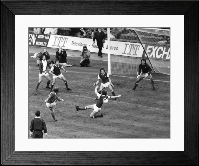 Framed Print : Birmingham Citys Gordon Taylor fires at the arsenal Goal despite a tackle from Alan