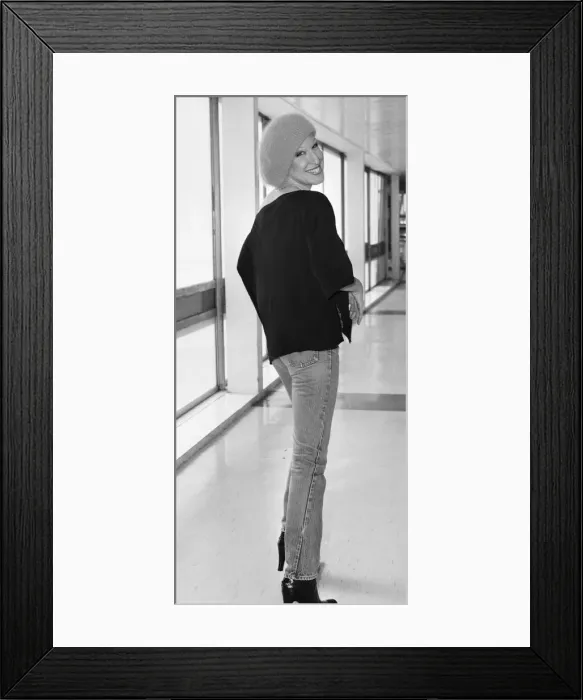 Framed Print : Singer and actress Bette Midler seen here arriving at Heathrow Airport from the USA