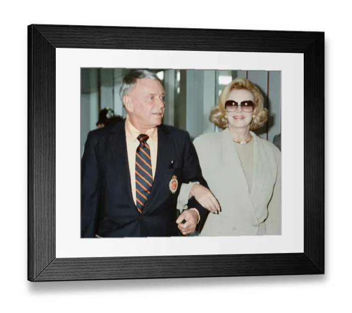 Framed Print : Frank Sinatra and wife Barbara Marx seen here arriving at Heathrow Airport 11th July 1990
